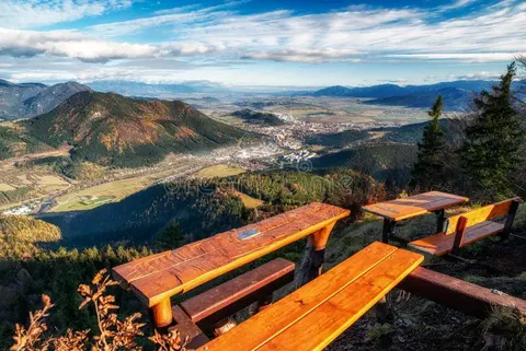 a wooden viewpoint bench overlooking the mountains near Ružomberok